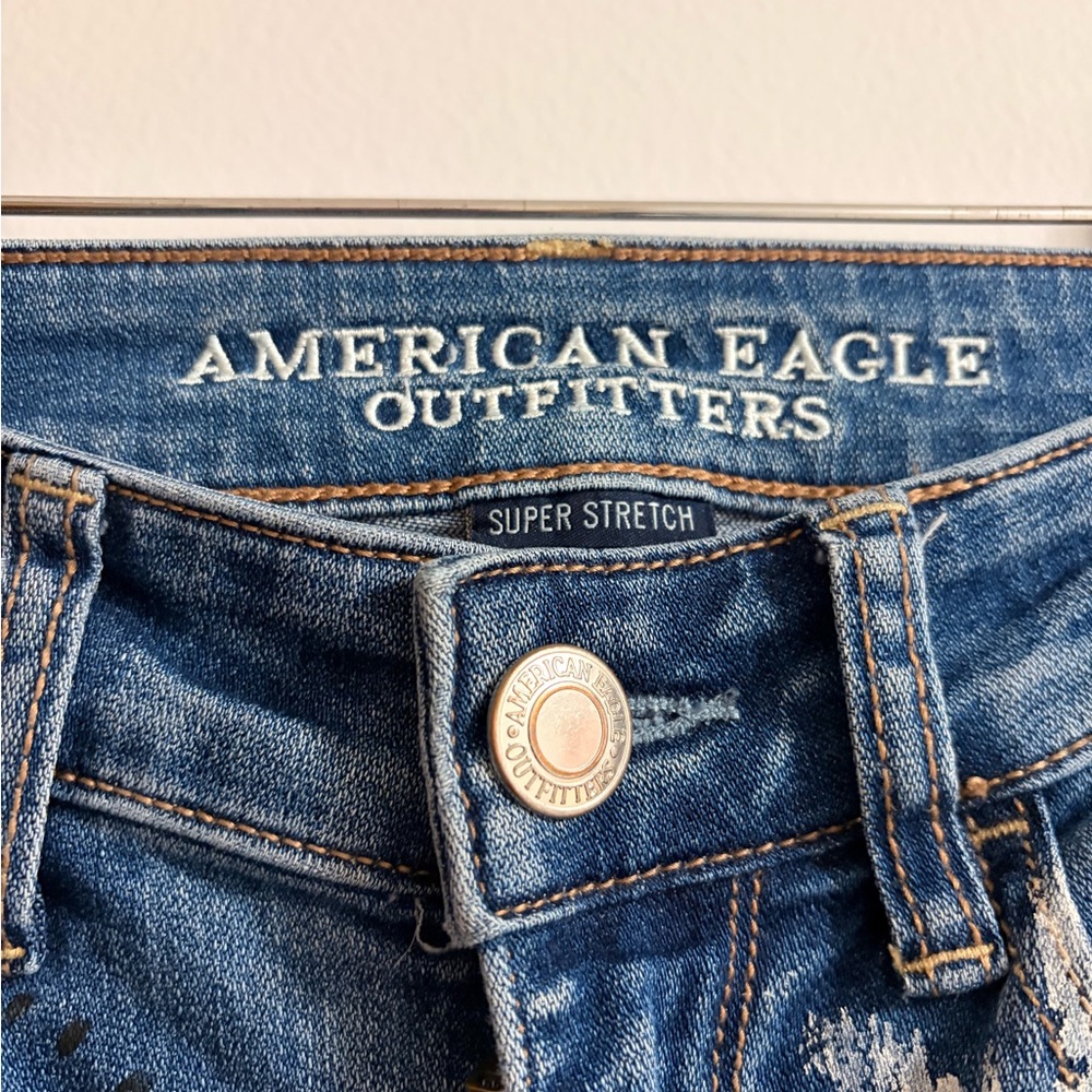 Distressed Blue Graphic Women’s Jeans with Patch & Embroidery - Picture 2 of 10